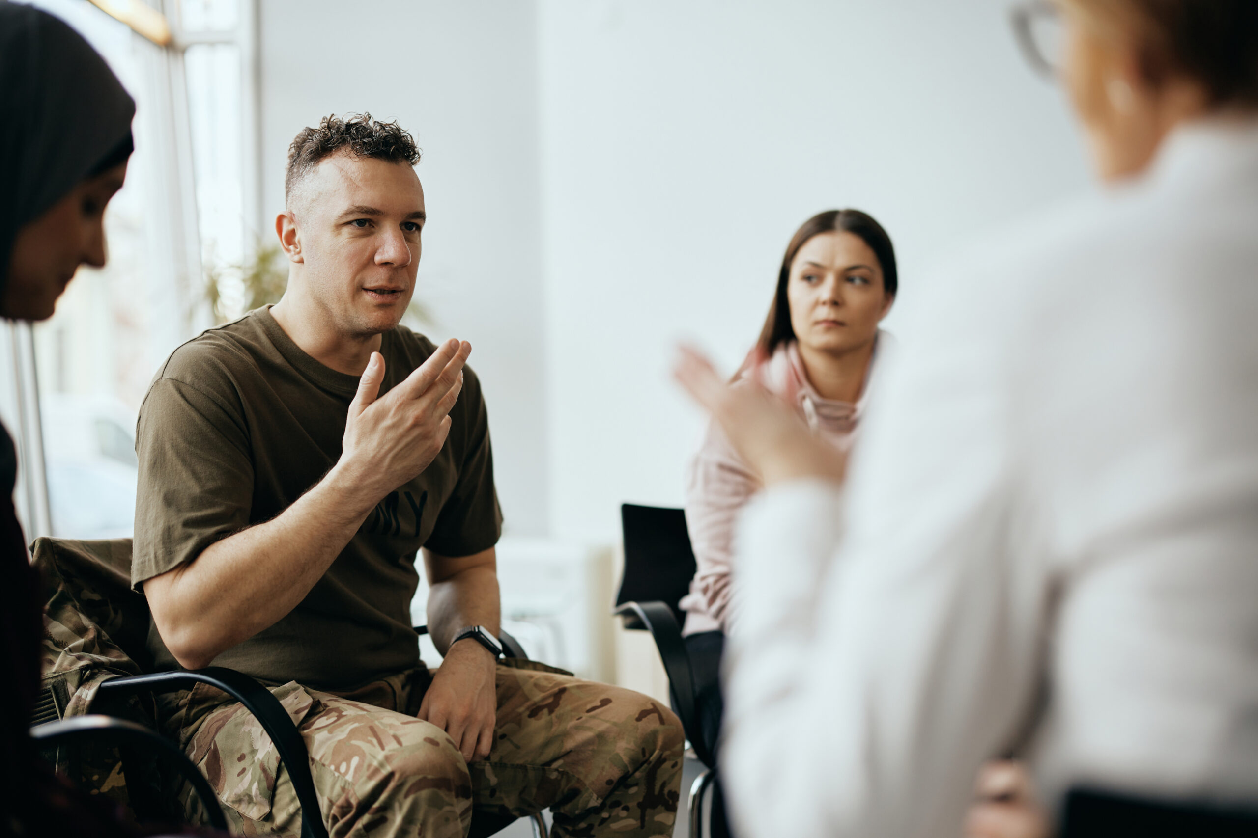 Veteran speaking at a group therapy session